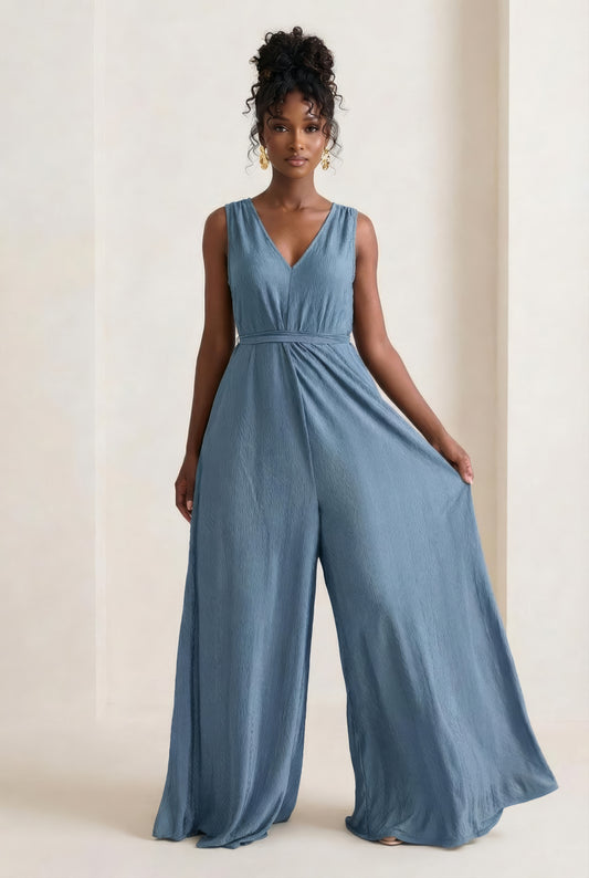 Saeeda Jumpsuit in muted blue worn by a model.