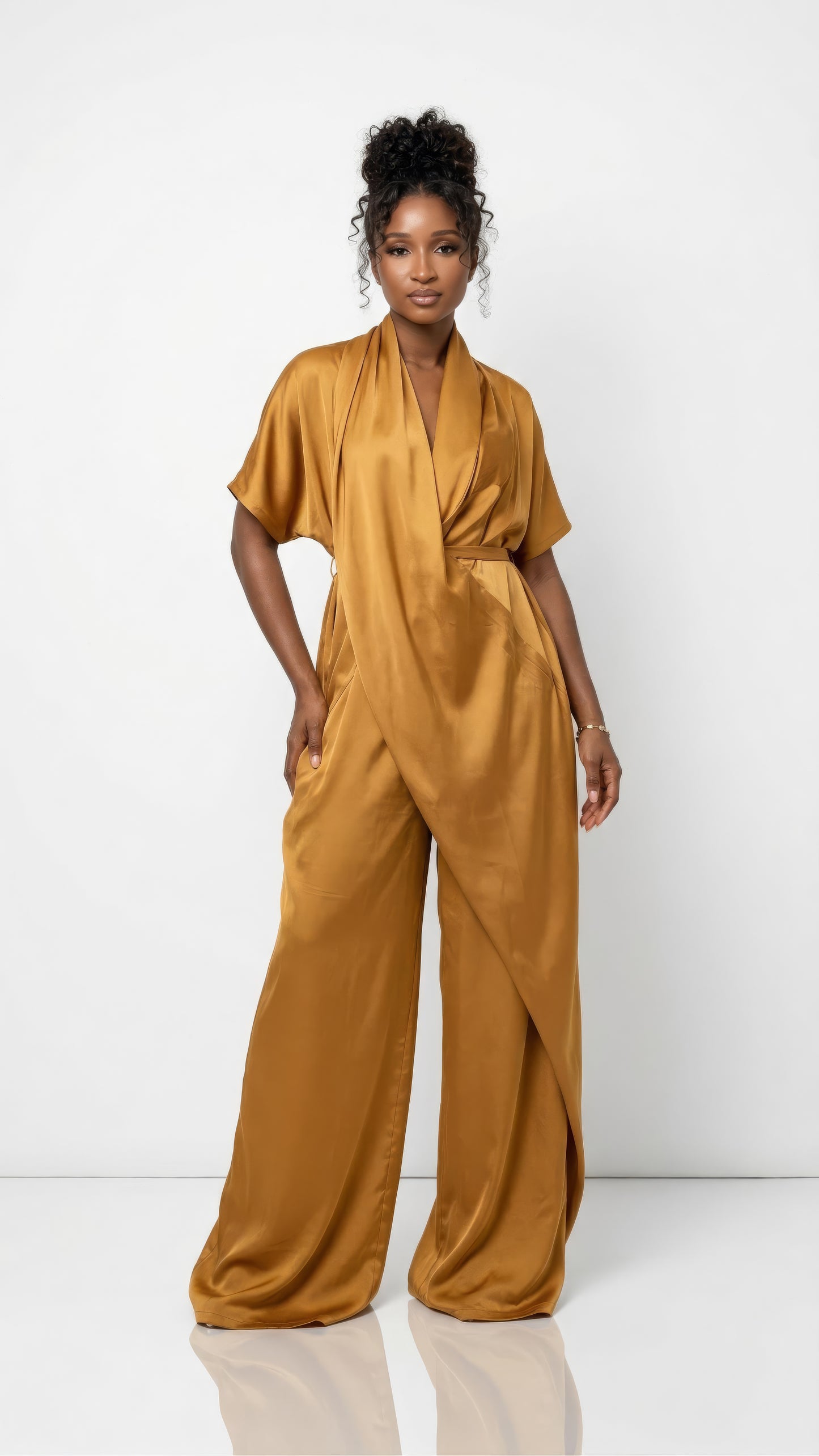 Burnt sienna Anisah Jumpsuit from Nahota Kanma, made from Duchess Satin with wide-leg, draped neckline and batwing sleeves.