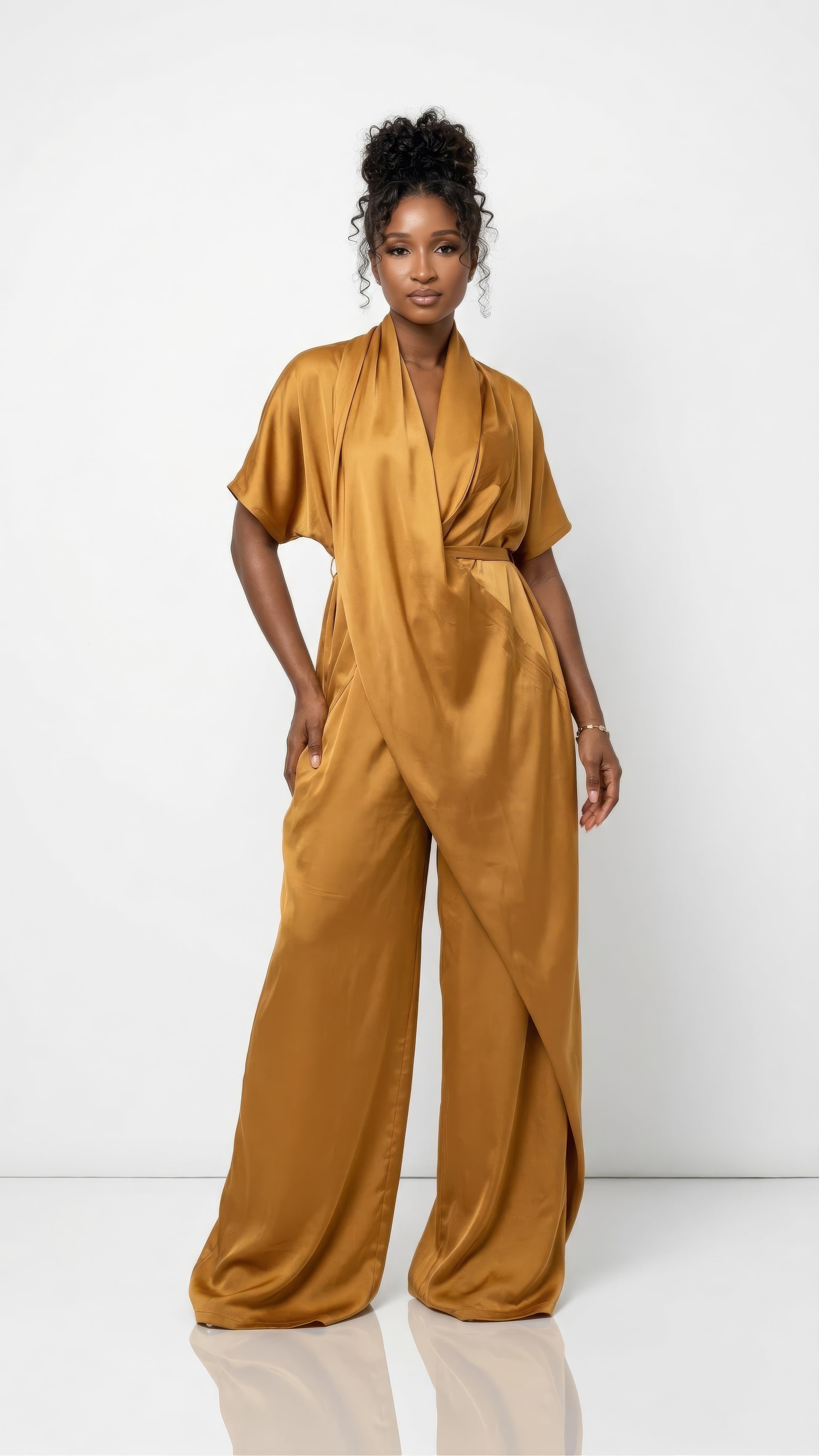 Burnt sienna Anisah Jumpsuit from Nahota Kanma, made from Duchess Satin with wide-leg, draped neckline and batwing sleeves.
