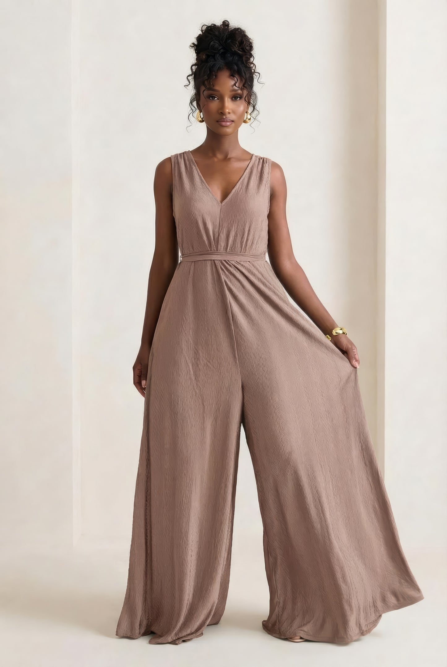 Saeeda Jumpsuit in timeless taupe worn by a model.